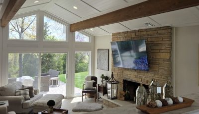 living room with brick fireplace