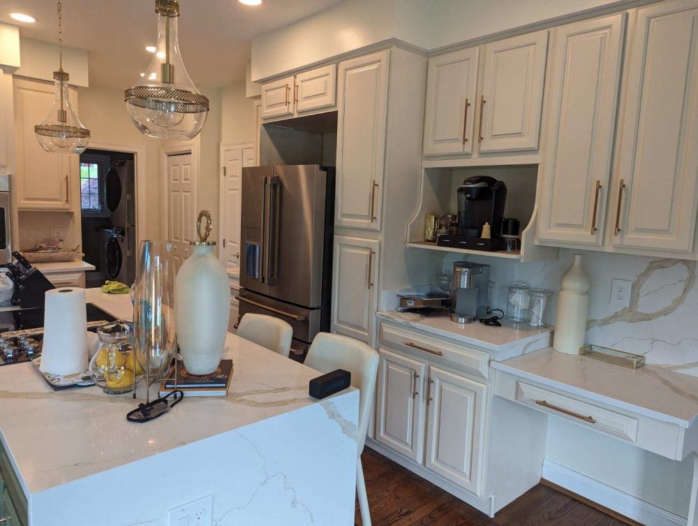 Freshly painted white kitchen cabinets at a home in Lothian, MD