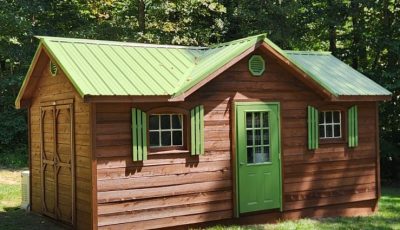 Painted and power washed outdoor shed, viewed from the front