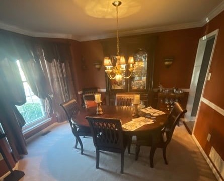 Before picture of a reddish/brown dining room