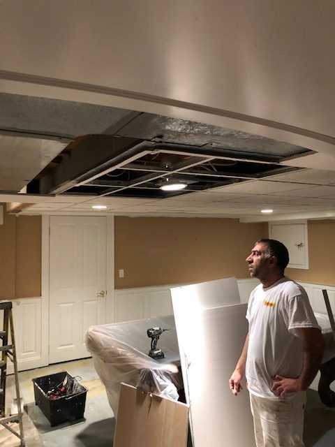 painter inspecting damaged ceiling Preview Image 2