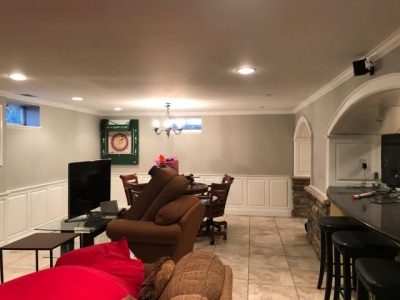 full view of the finished basement paint job with gray walls and white ceiling and trim
