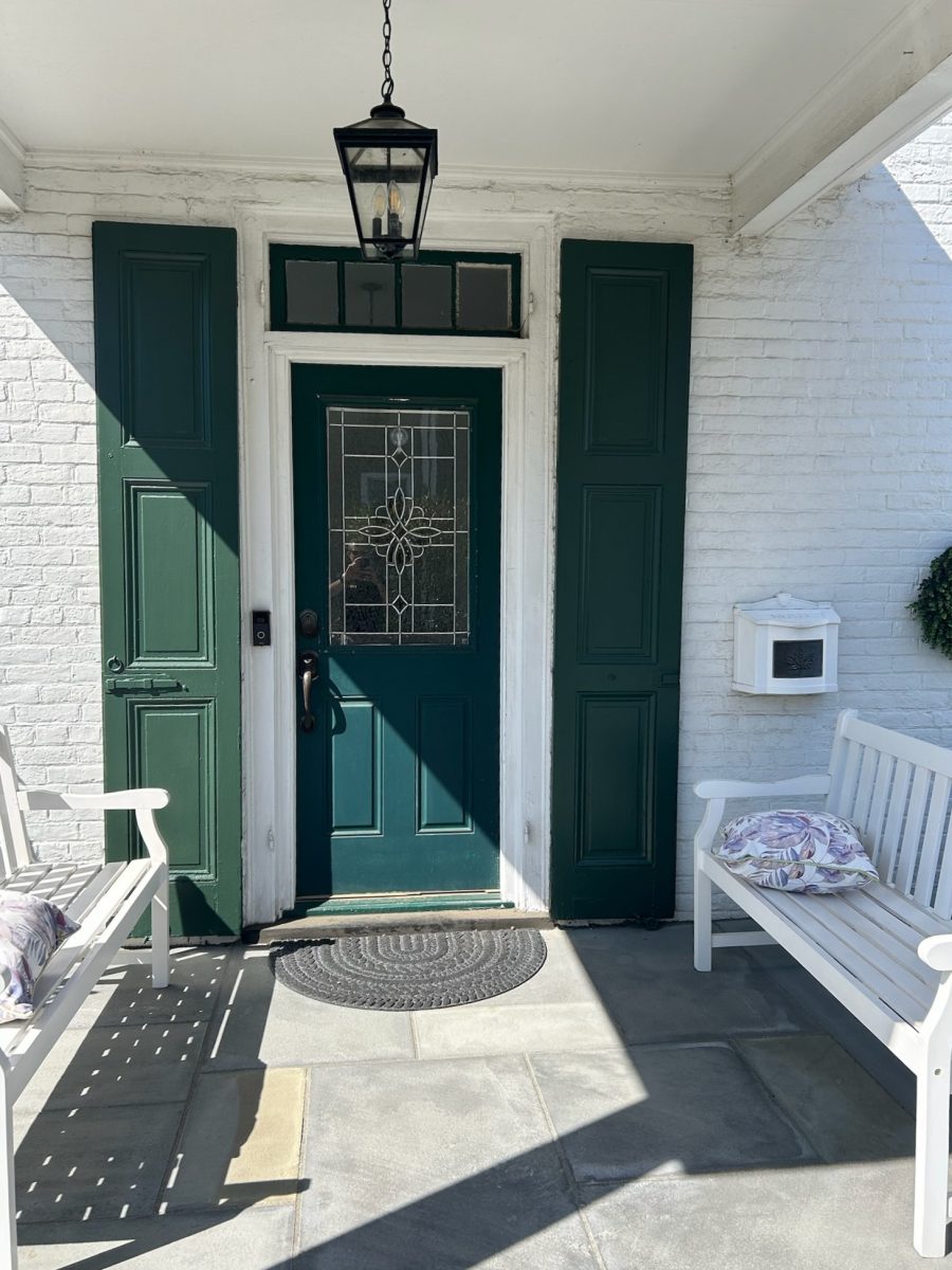 painted green door and shutters on house