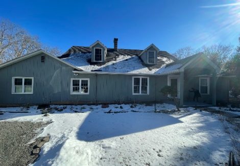 house with snow covered ground