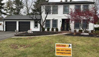 house with white painted siding and black trim