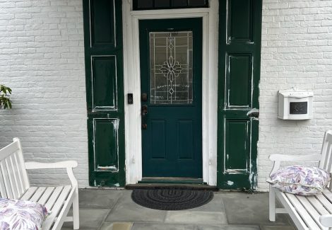 front door of house with peeling paint