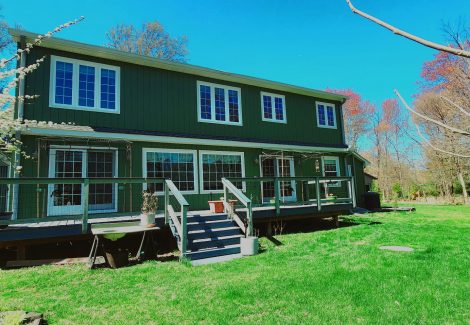back porch and dark green painted house
