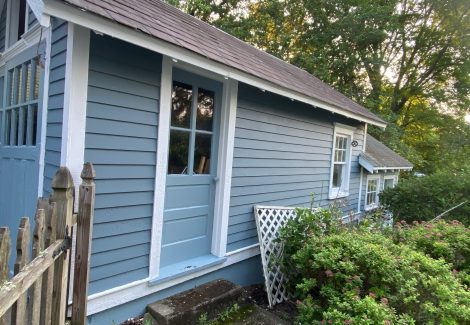 house with blue siding and whit trim