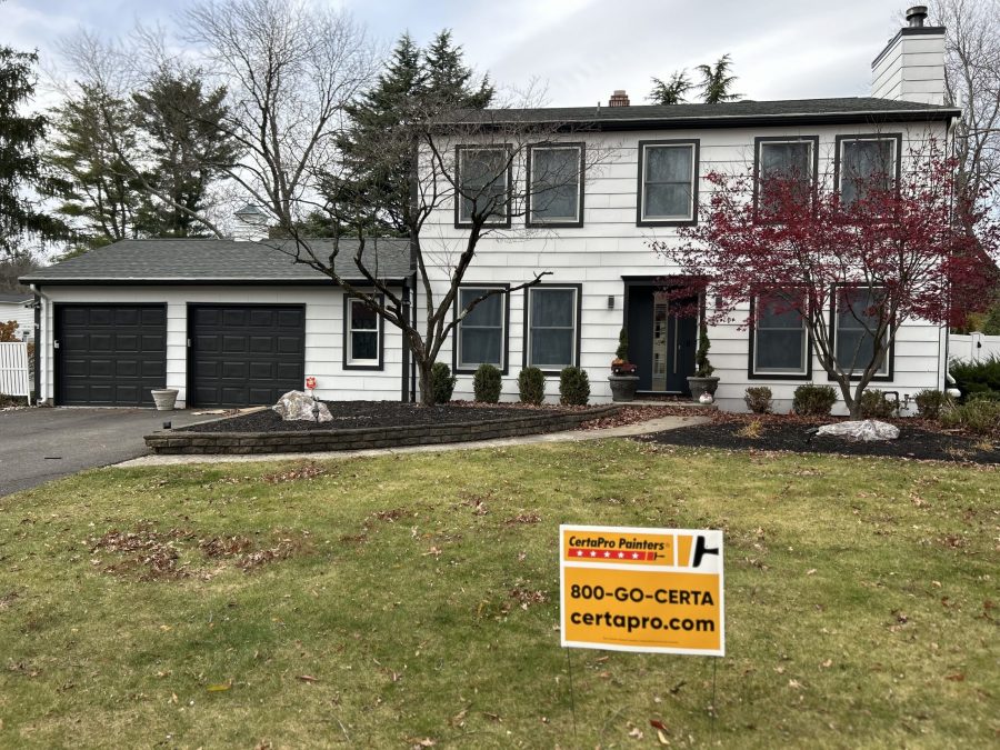 house with white painted siding and black trim
