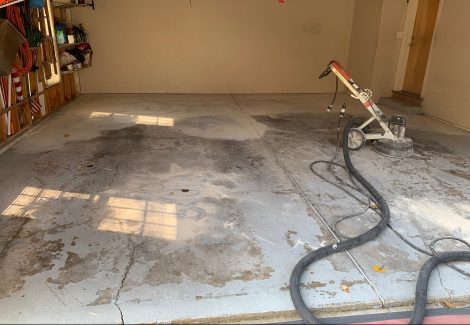 Working on garage floor before applying protective coating