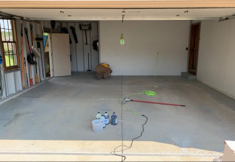 Unfinished garage floor with failing spots