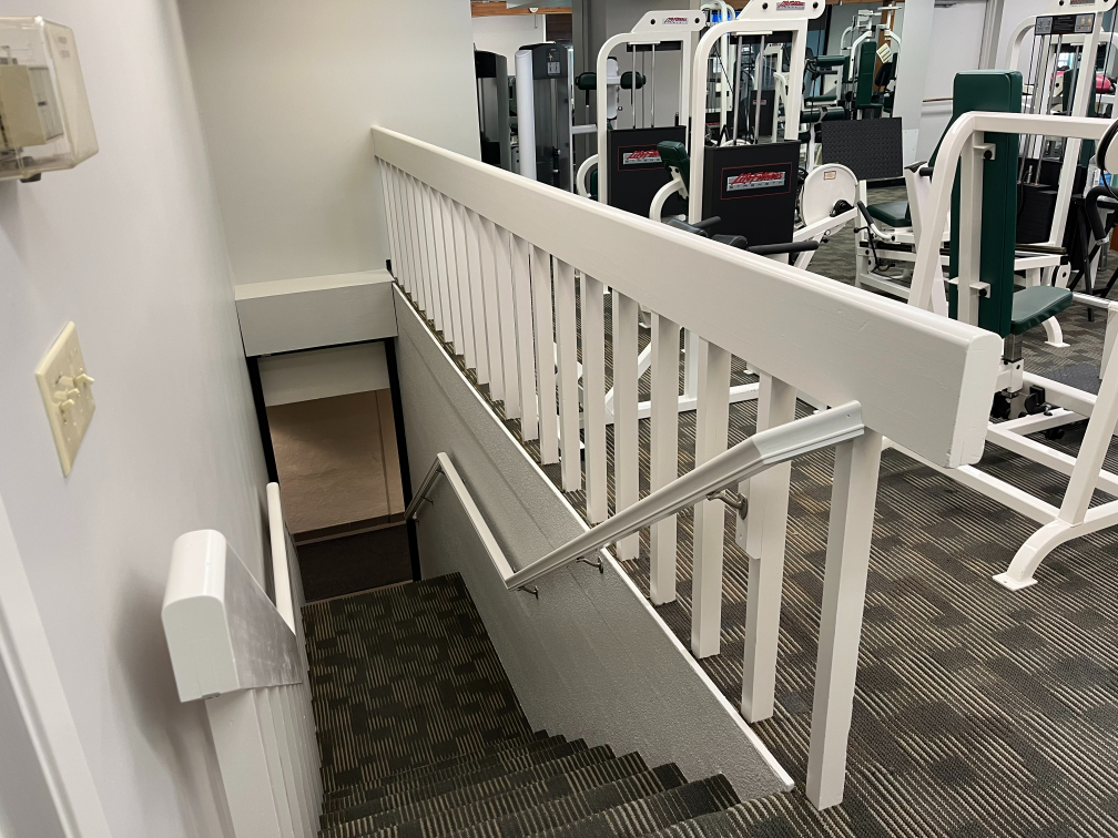 Walls and enamel railings in health club, after painting