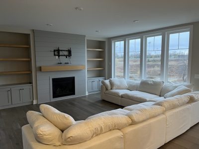 Living room with painted accent wall and a large couch
