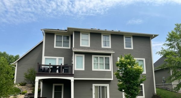 View of repainted house in Plymouth from the backyard, after painting