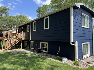 Home With Large Garage in Plymouth - Back porch view of house after painting