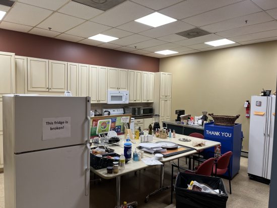 fridge and common table in office breakroom prepared for wall painting at The Food Group in New Hope MN