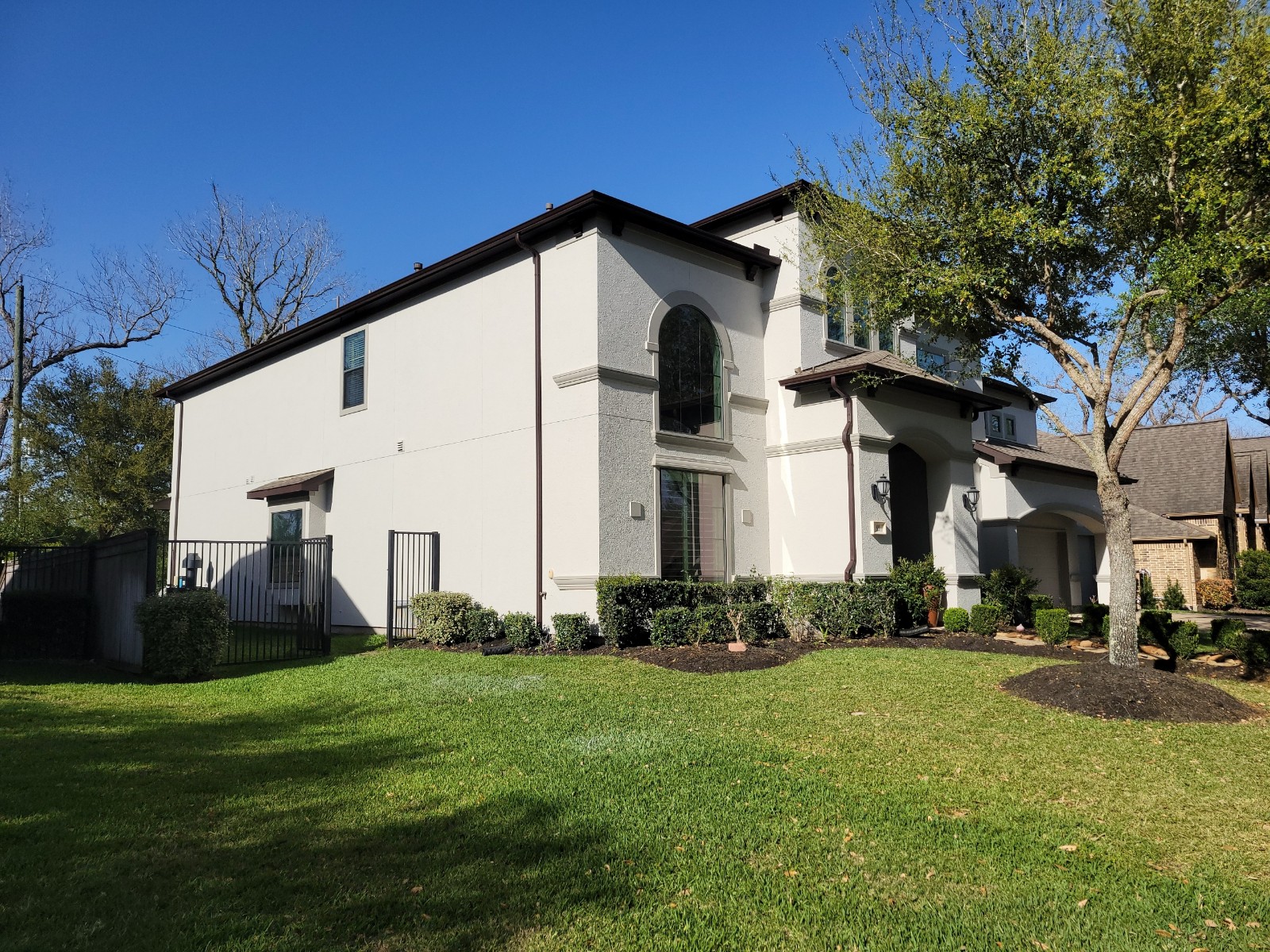 Stucco Sienna Home Exterior Painting Before & After After