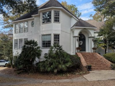 house with white painted stucco exterior