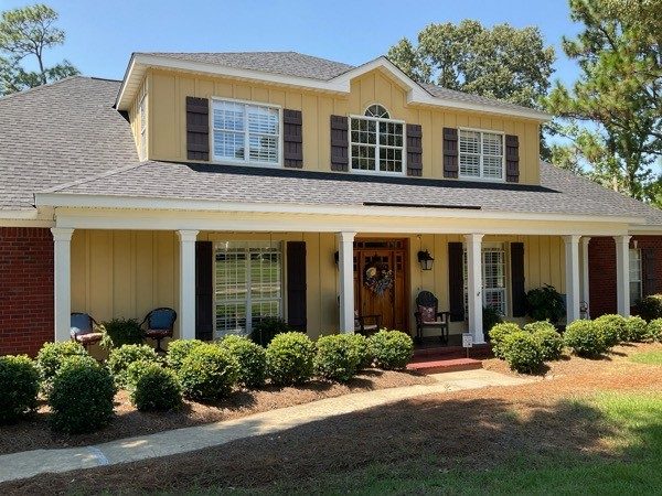 house with off white siding and dark shutters Preview Image 3