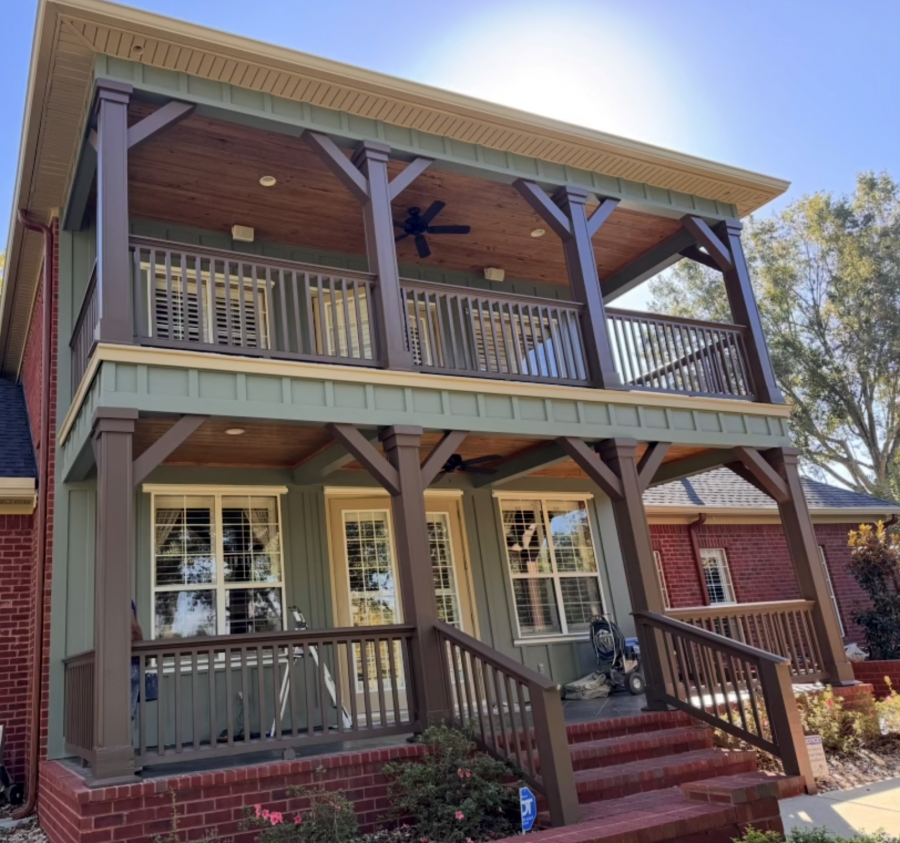 house with green painted siding and rust colored accents and posts Preview Image 1