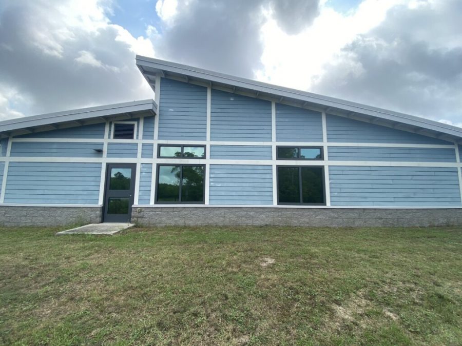 exterior front view of blue commercial building before painting Preview Image 2