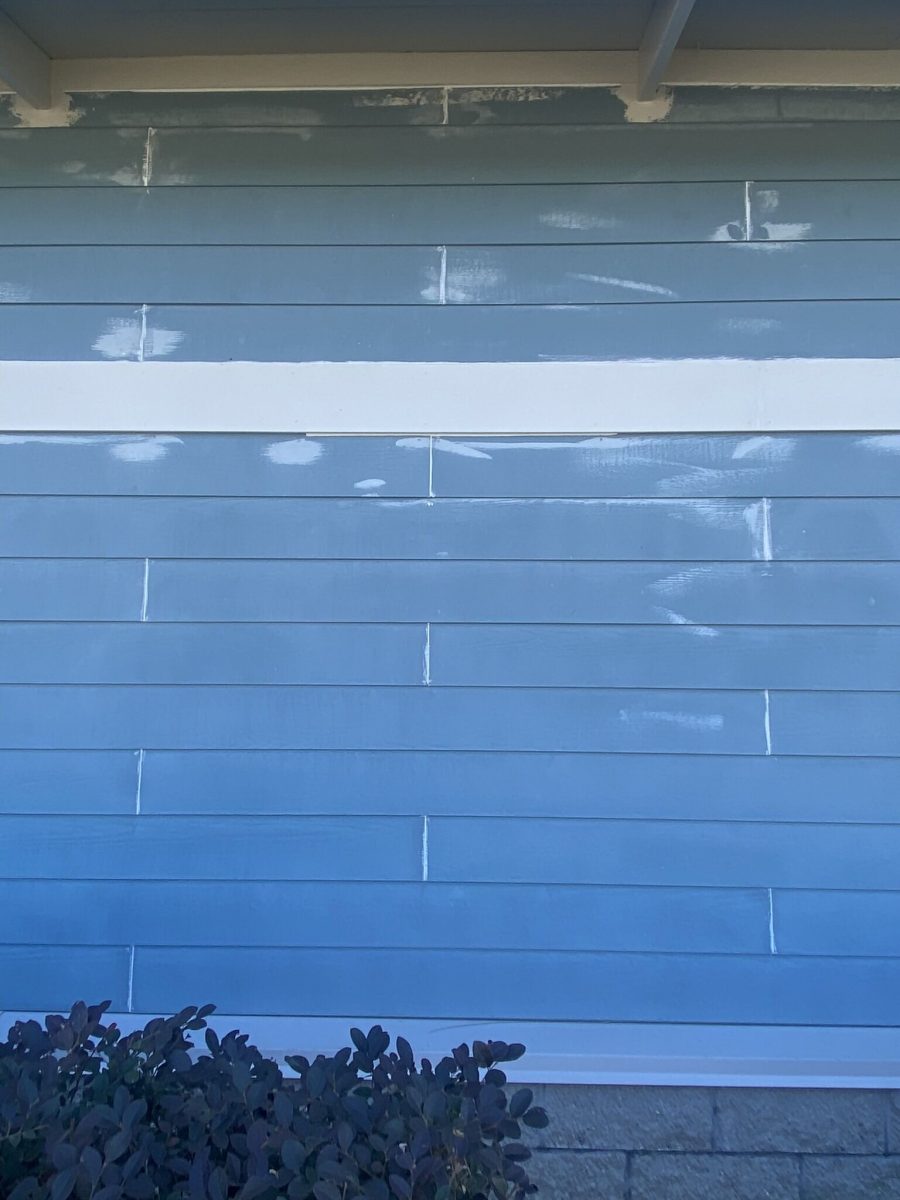 view of blue exterior wall in process of being painted Preview Image 8