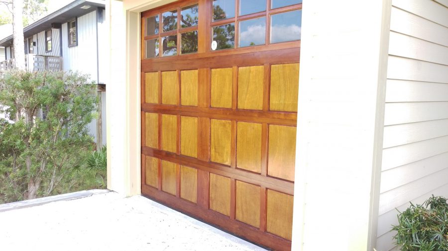 stained two-toned wood garage door with glass windows along the top Preview Image 5