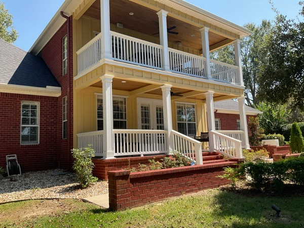 house exterior with porch and upper balcony before painting Preview Image 2