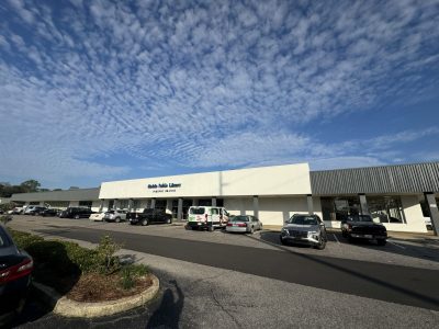 repainted shopping center stucco, concrete and metal facade