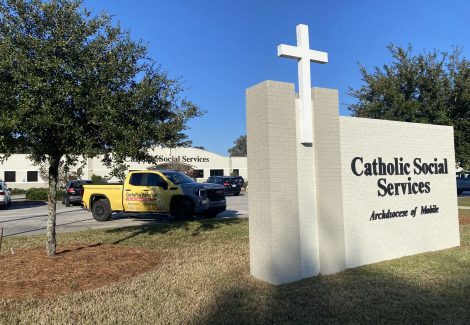 church sign in front of church parking lot