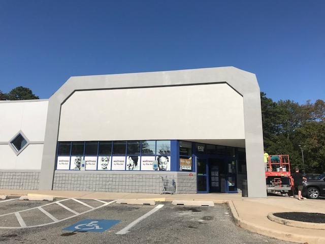 Side view of Rite Aid's front façade after completed commercial painting project by CertaPro Mount Laurel Preview Image 2
