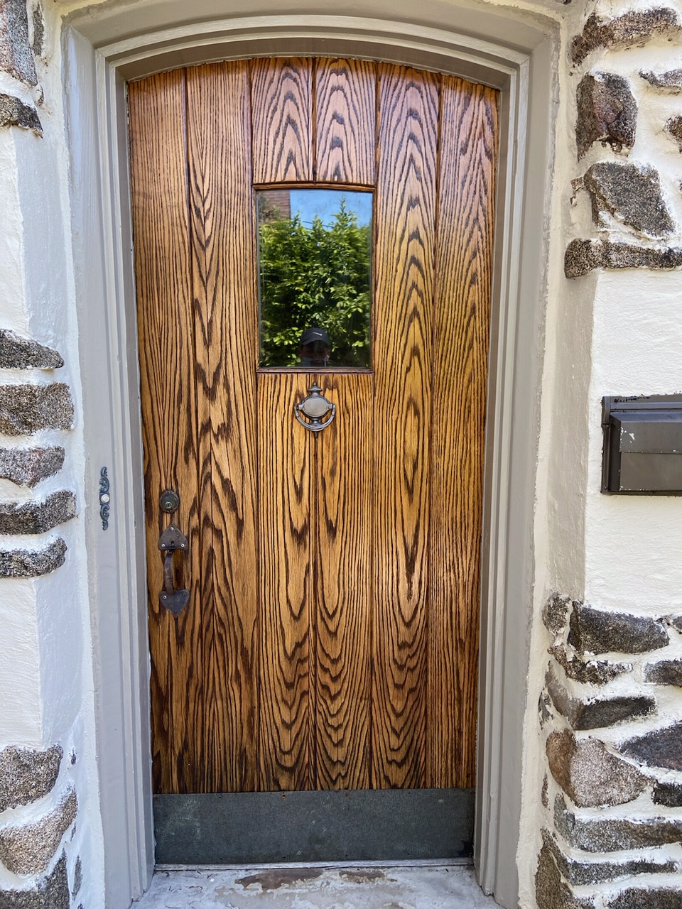 Natural wood entry door goes from faded to fresh After