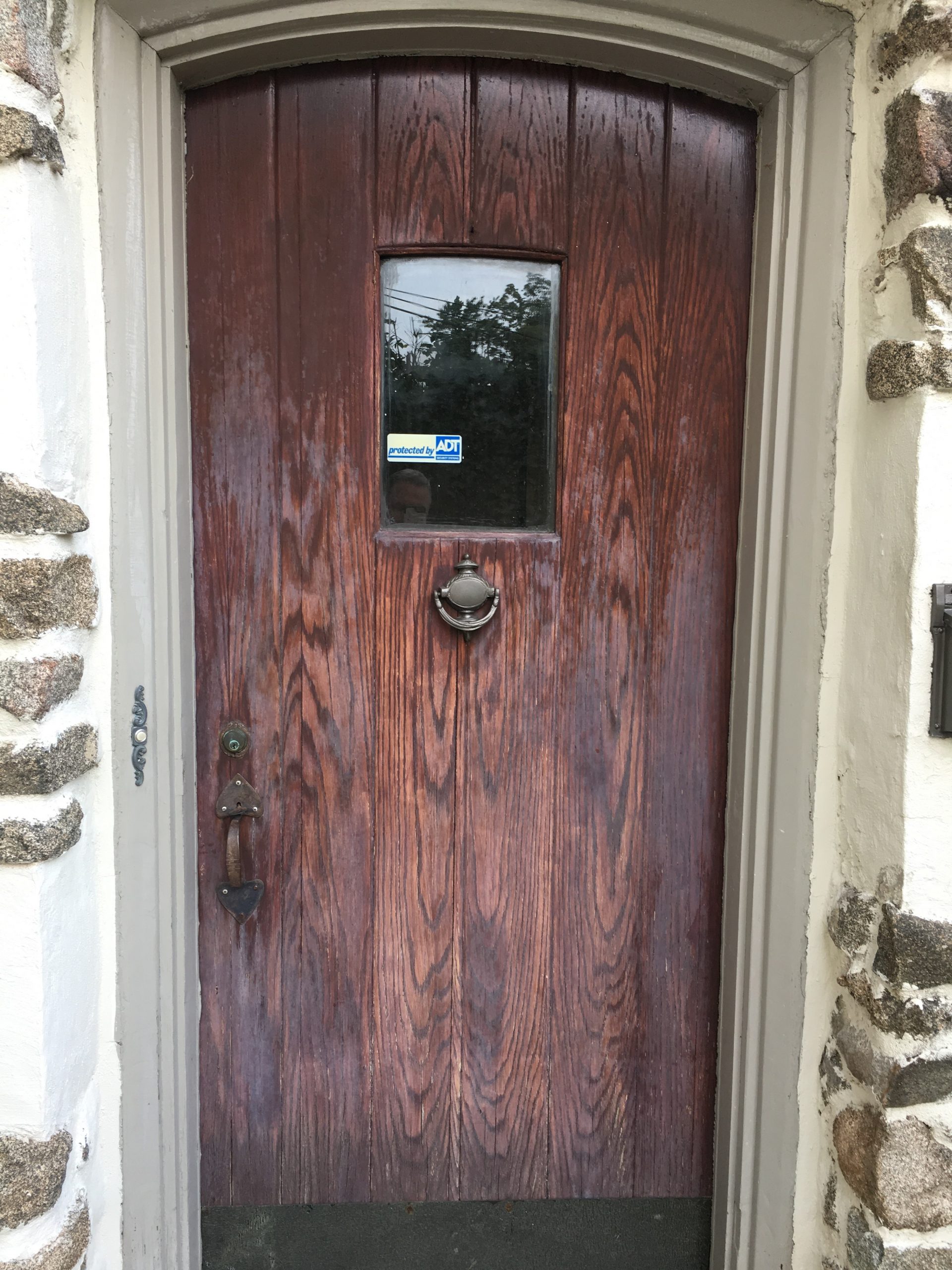 Natural wood entry door goes from faded to fresh Before
