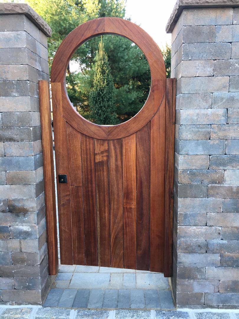 Exterior gate in natural wood finish After