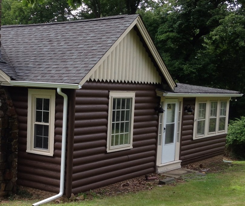 A quaint log cabin exterior restored to new After