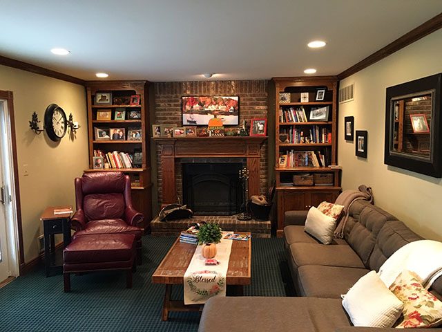 Family room with bookshelves and sofa Preview Image 1