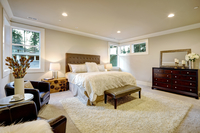 master bedroom with chairs