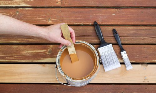 Staining a deck by hand