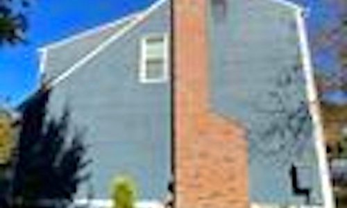 Side of House Before Repainting