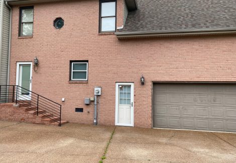 Side of brick home (before)