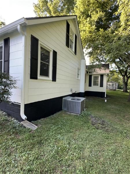side of house with white siding and black shutters Preview Image 2