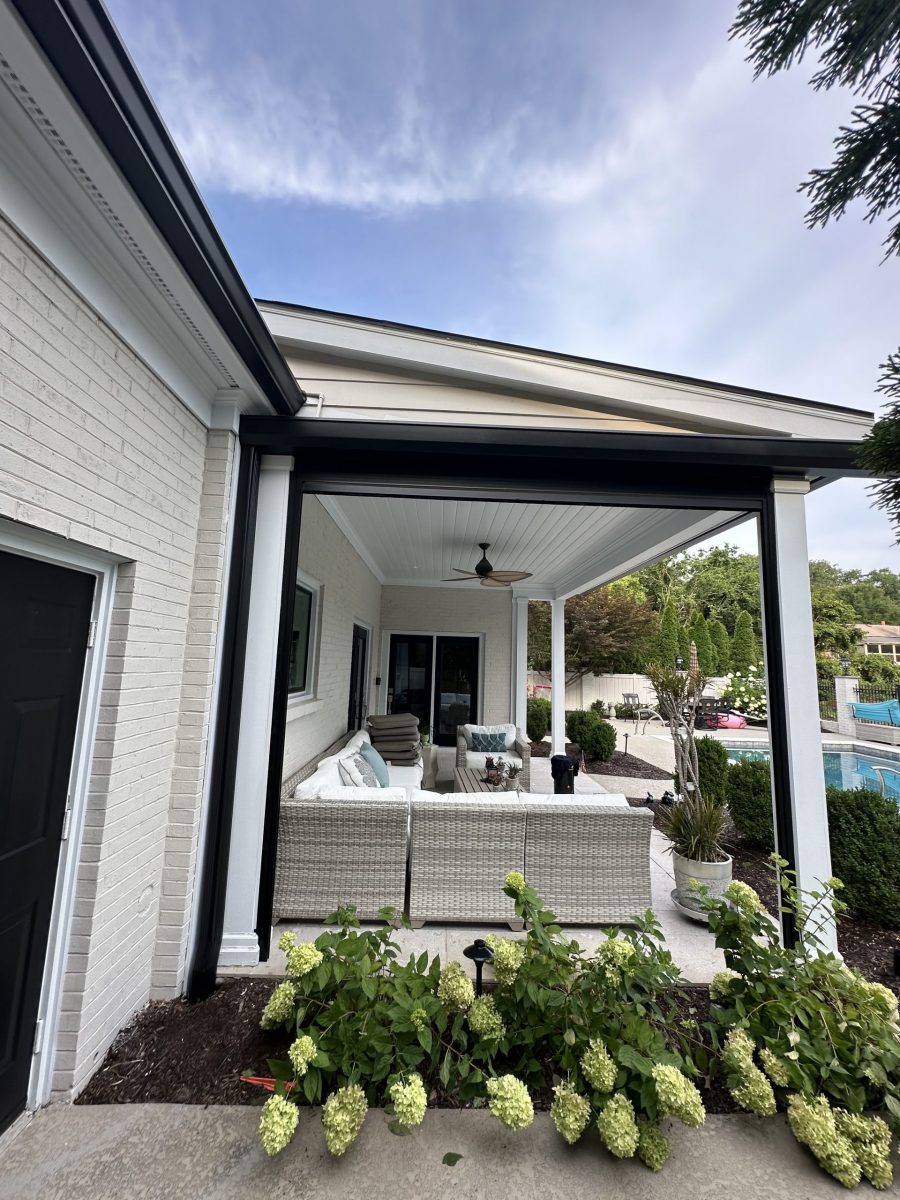 covered patio of white house with black painted trim Preview Image 2