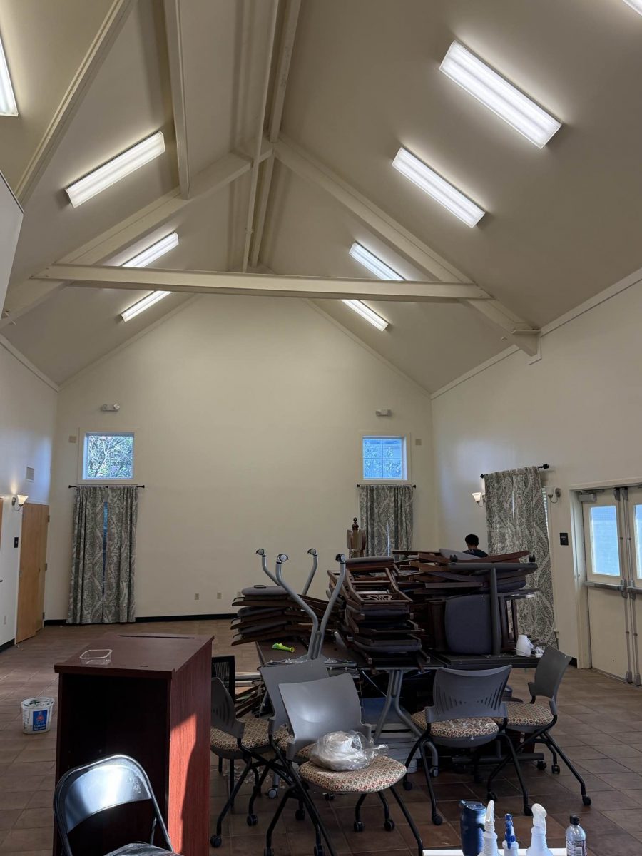 chairs and tables stacked in center of room Preview Image 1