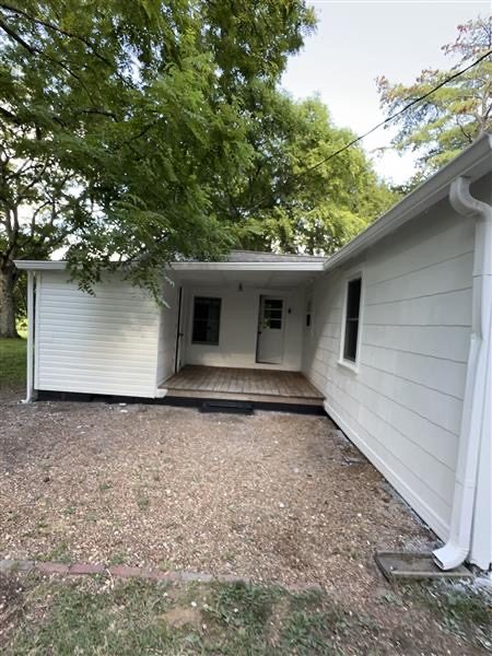side of house with white siding and black shutters Preview Image 4