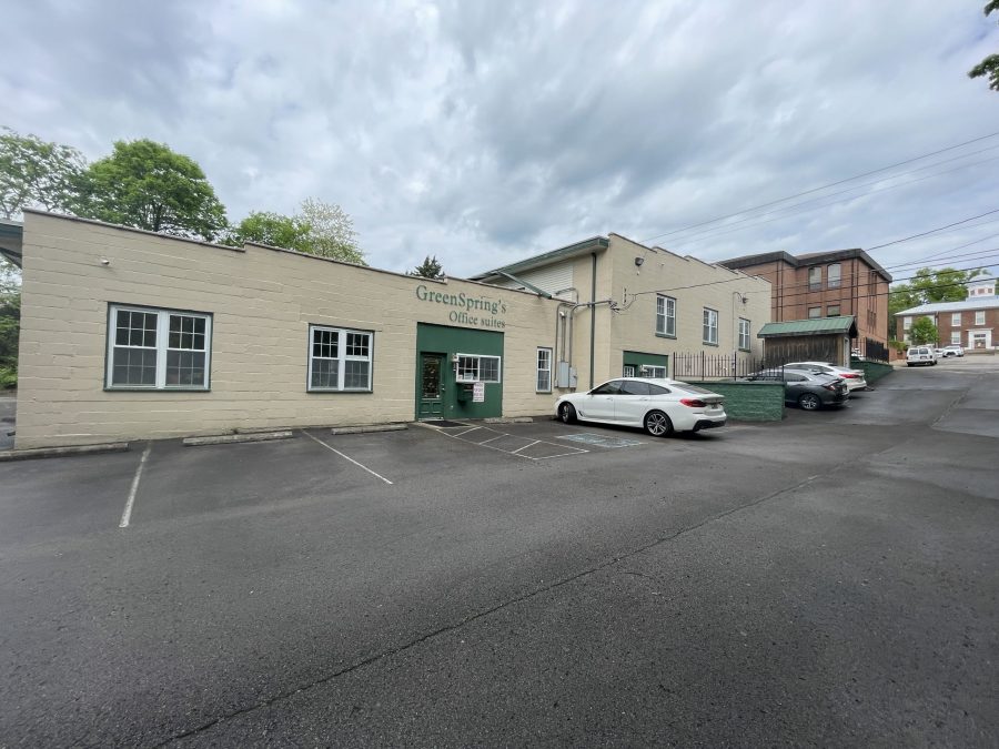 off-white and green commercial exterior before repaint Preview Image 9