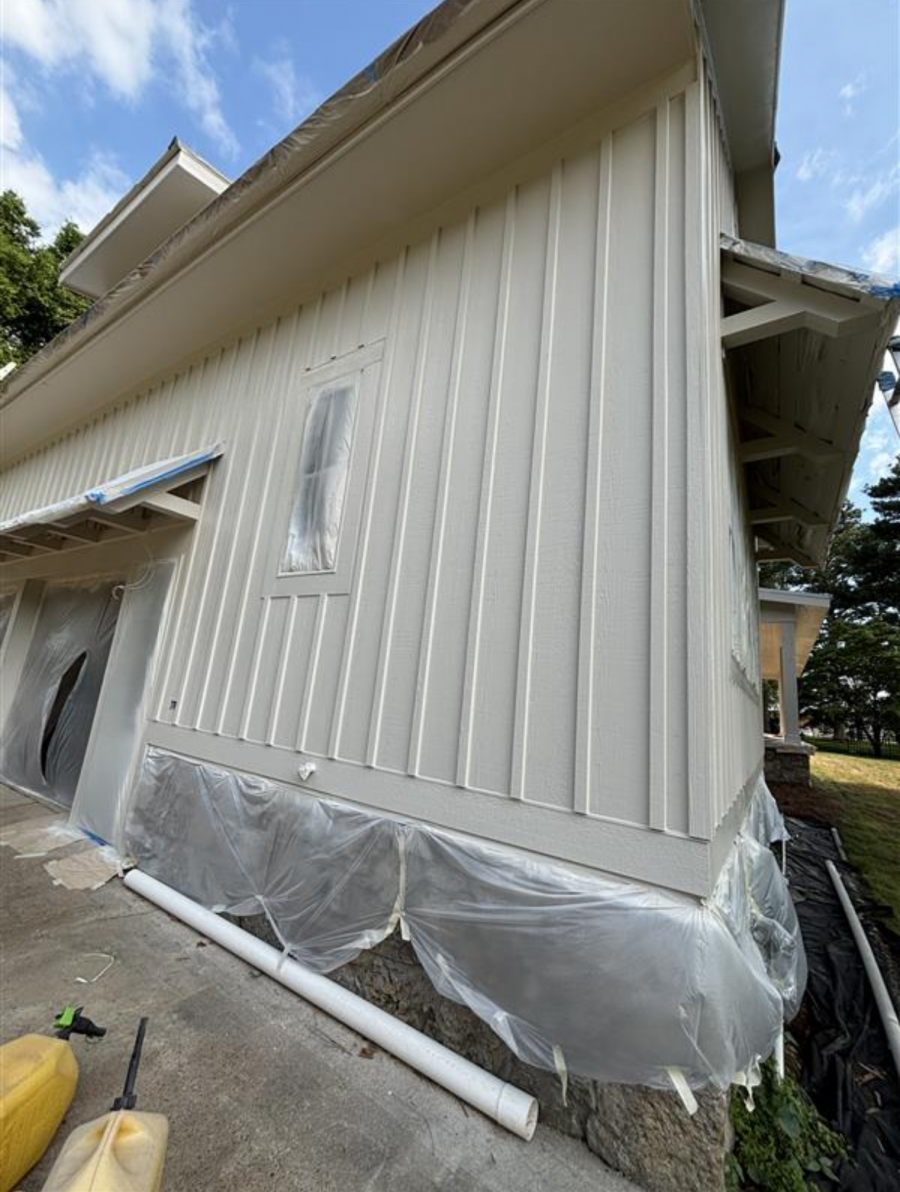 painters with ladders painting siding on house Preview Image 3