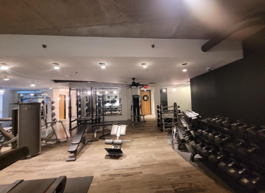 gym facility with weight benches and free weight racks Preview Image 1