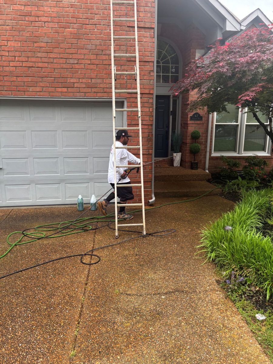 painters on ladders outside brick home Preview Image 3
