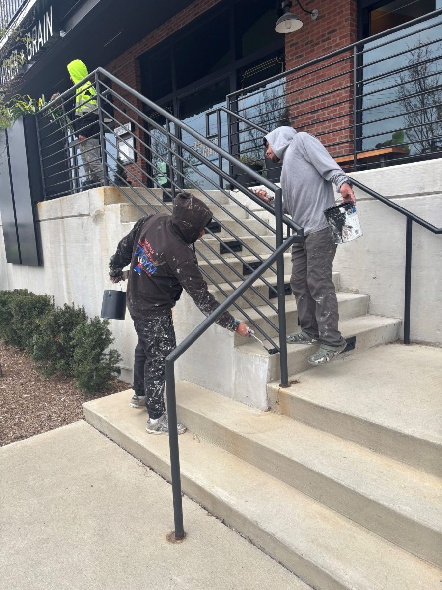 two painters working on outside stairway rails Preview Image 7