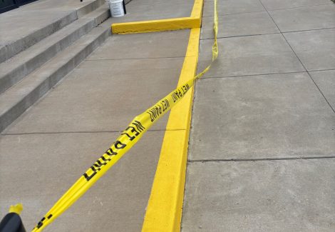 sidewalk with yellow safety paint